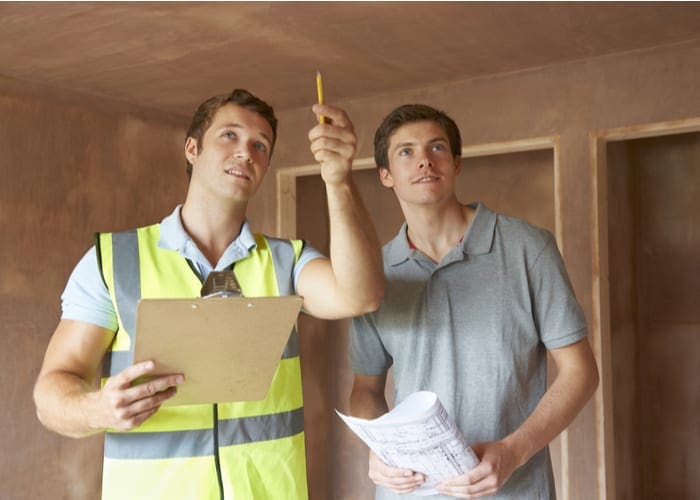 Builder And Inspector Looking At New Property as an image for an article on For Sale by Owner Homes