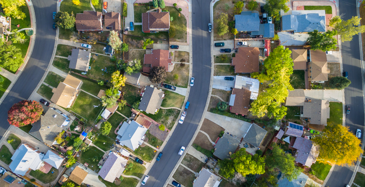For a review on REIpro, an aerial view of homes in a suburban neighborhood