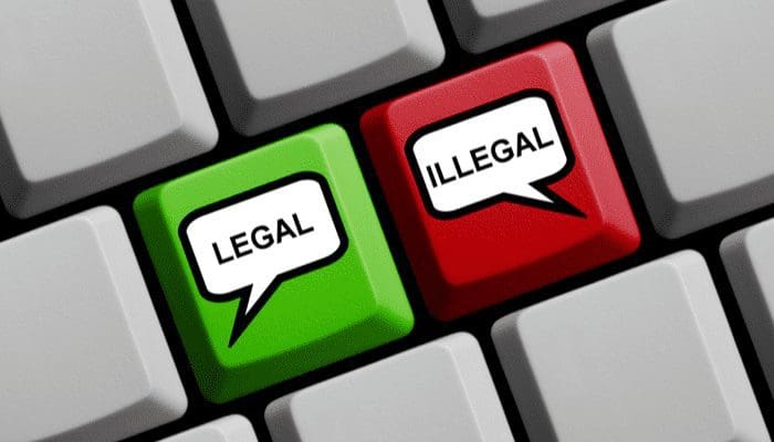 Computer Keyboard with speech bubble symbols on red and green key showing Legal or Illegal as an image for a piece on pocket listings