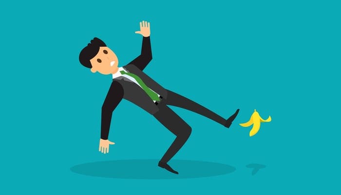 To symbolize a lack of errors and omissions insurance, Flat style image of man in suit slipping on banana skin and falling down. Making mistakes known errors in business concept. Eps vector illustration, horizontal image, flat style graphic design.