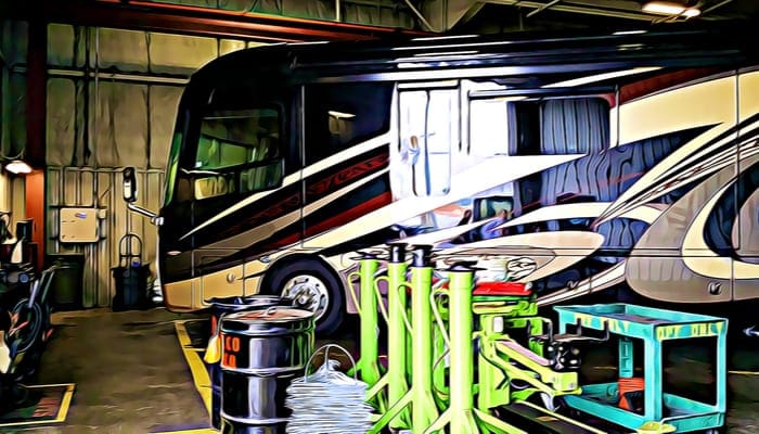 Luxury Motorhome recreational vehicle RV in repair shop with reflections from outside
