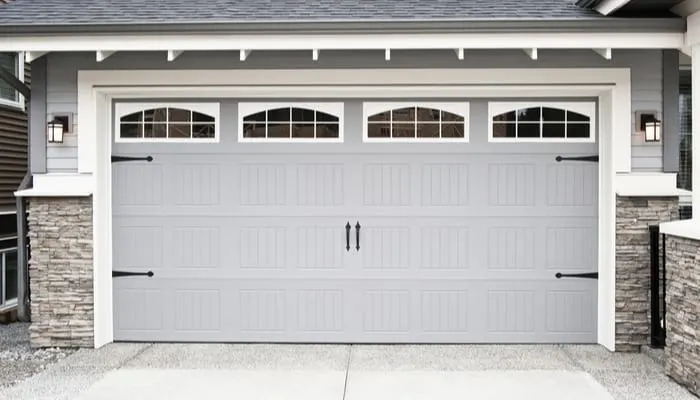 A standard garage door size on a nice grey home