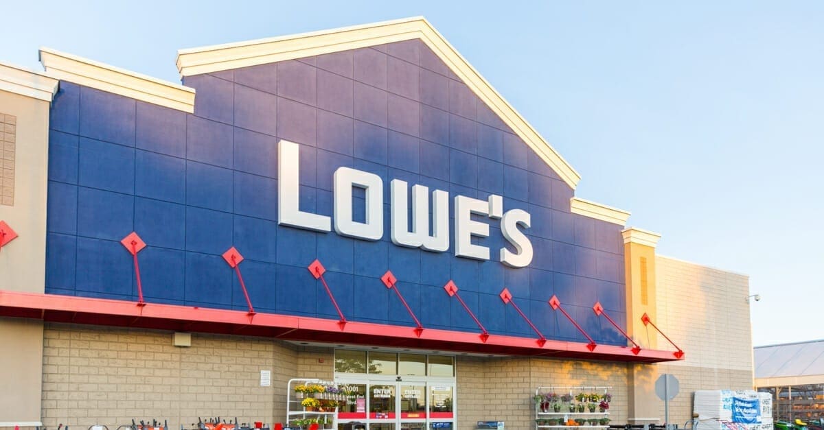 Exterior of a Lowe's store against a cloudless blue sky