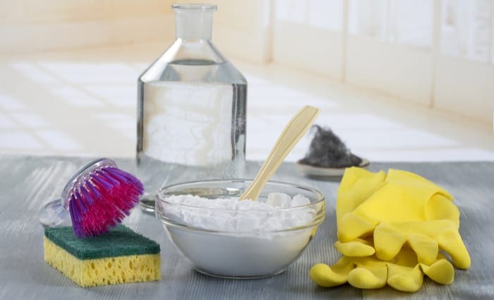 To clean hard water stains from toilet, a bunch of vinegar, sponges, and gloves