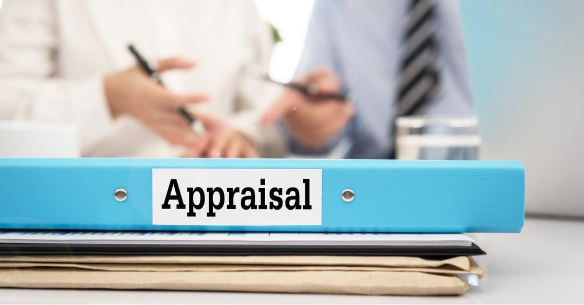 Appraisal documents on desk with manager and board are discuss about property appraisal or the appraisal process and performance ratings. as the featured image for a piece on VA Appraisals