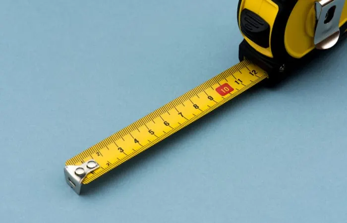 Yellow Measuring Tape as the featured image for a piece on standard refrigerator sizes