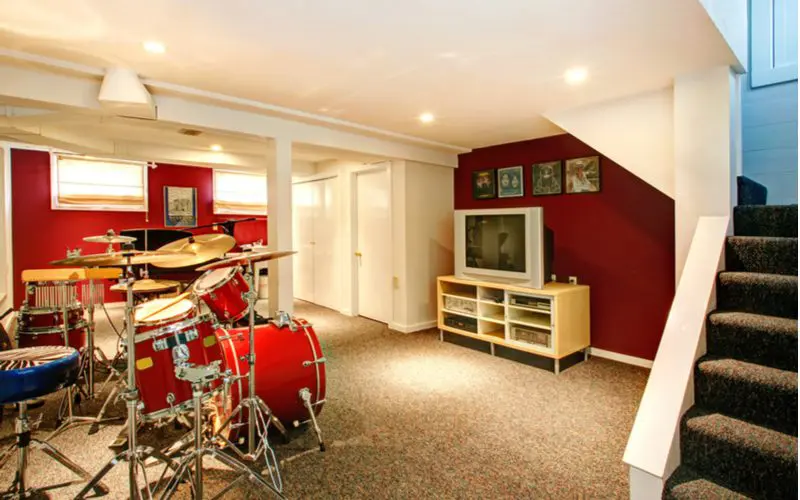 Idea for an unfinished basement to turn it into a recording studio, complete with painted walls and musical instruments
