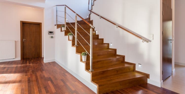 Image of wooden staircase in front hall as the featured image for a piece on Stair Railings