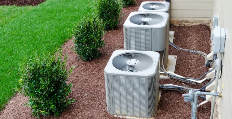 AC units connected to the residential house as a piece on air conditioner maintenance