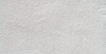 A photo of a lightly done wall texture that is white in color