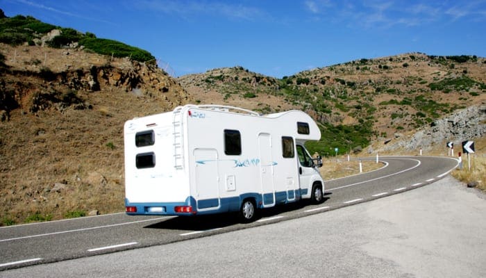 Sardinia 23.09.2008. Tourist camper on a asphalt road in the mountains of Sardinia
