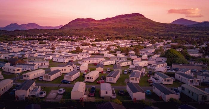 Sun set at a Caravan and camping park, static home aerial view. Porthmadog holiday park taken from the air by a drone