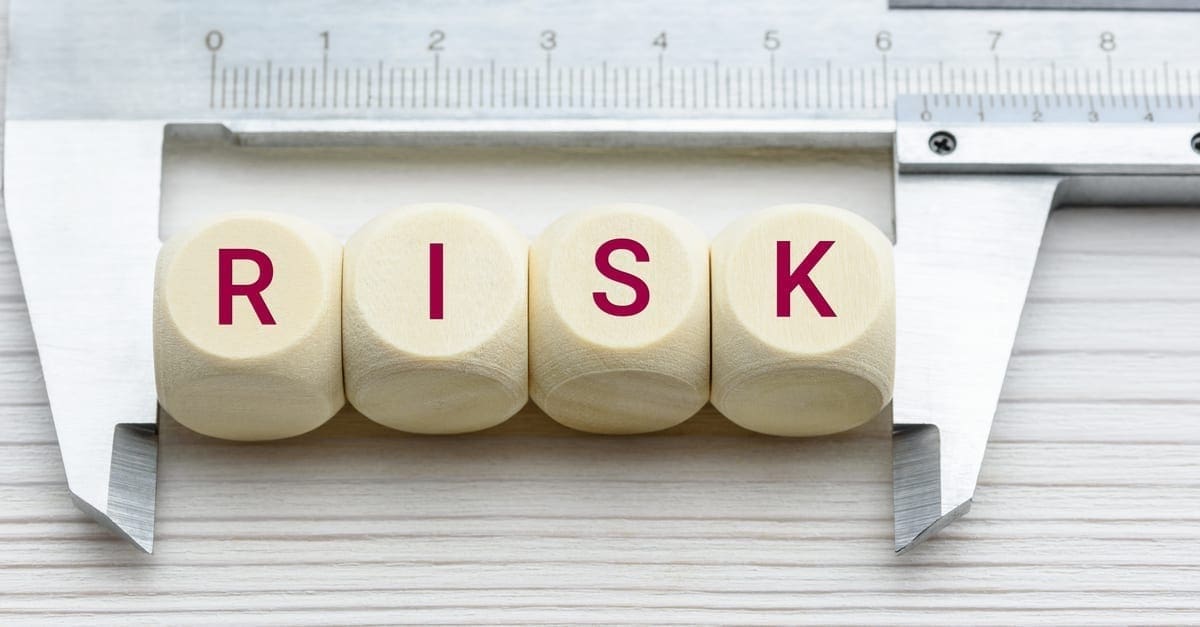 Risk assessment / risk analysis and management concept : Words RISK on wood blocks and a vernier caliper with scales, depict evaluation for financial risk of an investor involved in stock, bond market as the featured image for a piece on CoreLogic