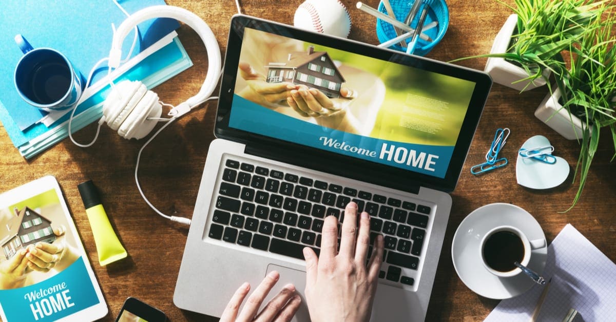 Real estate website mock up on laptop screen, tablet and smartphone