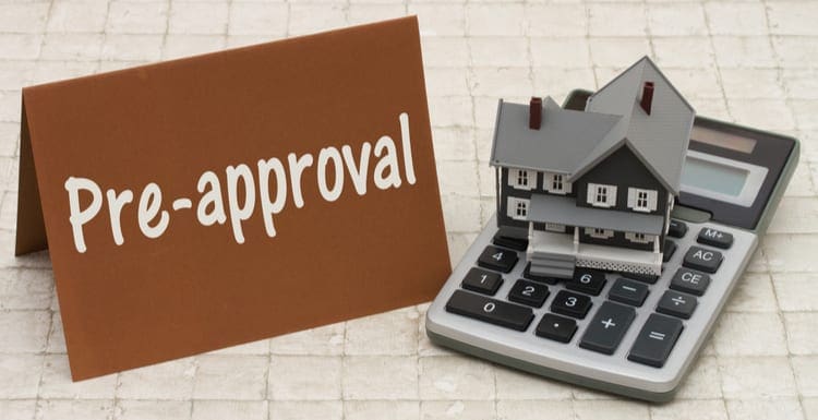 Home Mortgage Pre-approval, A gray house, brown card and calculator on stone background with text Pre-approval as the featured image for a piece on How Long Does a Mortgage Pre Approval Last