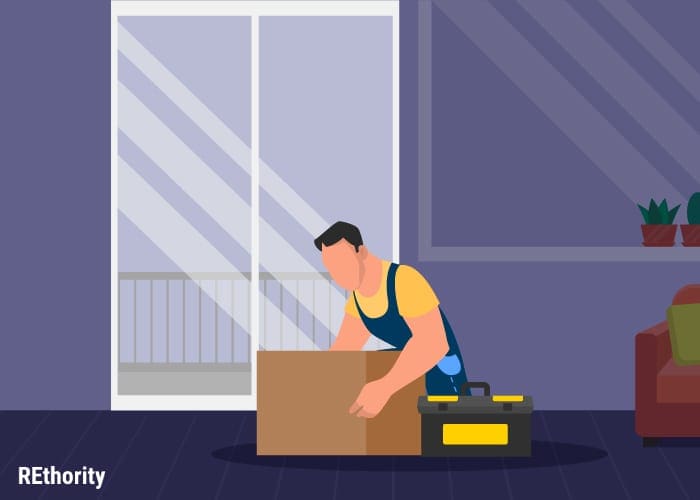 Image showing a person holding a box to move things out of the way when removing a sliding glass door