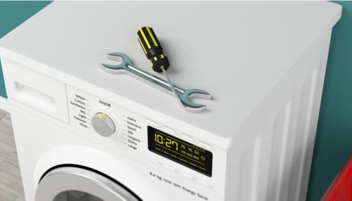 Home appliances service. Clothes washing machine and hand tools on green wall background. 3d illustration
