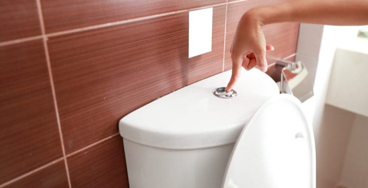As an image for slow flushing toilet, toilet with a flush. Press and flush.
