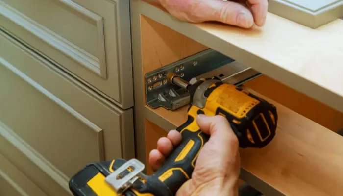 Adjusting fixing cabinet door hinge adjustment on kitchen cabinets as an image for a piece on cabinet refacing