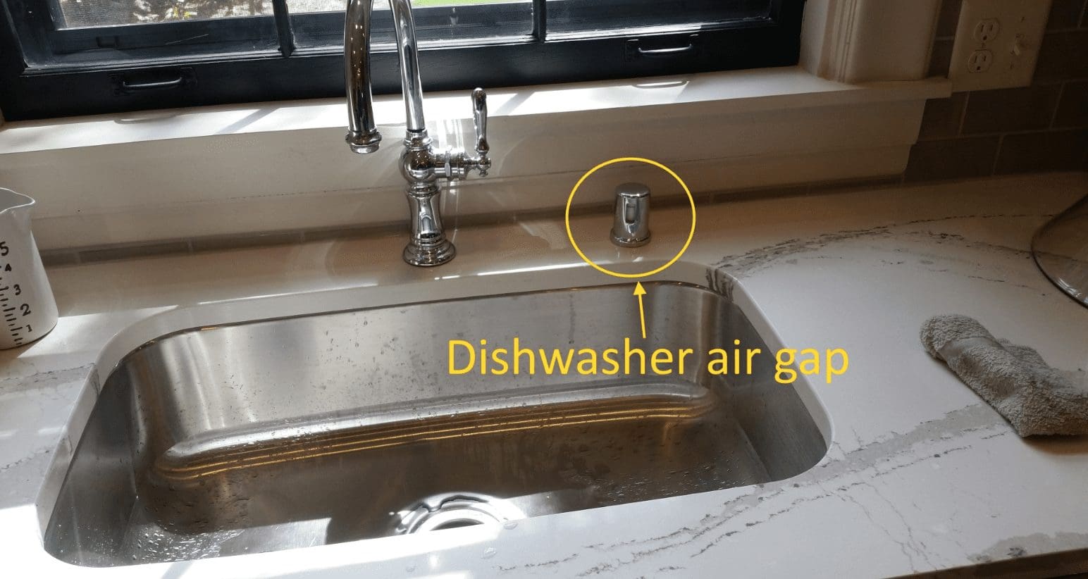 Plugged air gap as a reason for water in bottom of dishwasher