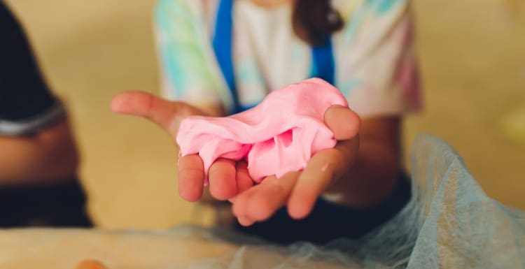 Ingredient for make home made Toy Called Slime, Teenager having fun and being creative homemade slime. Selective focus on Slime as an image for a piece on how to get slime out of carpet