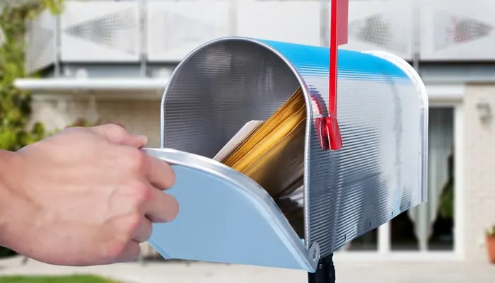 Close-up Of A Person Hand Checking Mailbox Outside The House to find off-market properties in your area