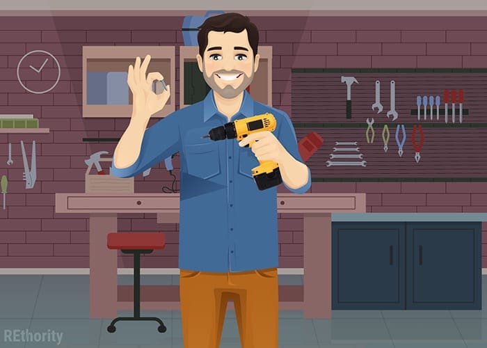 Image of a person in a REthority shirt holding a drill with a metal-shaving drill bit for a piece on how to remove a stripped screw