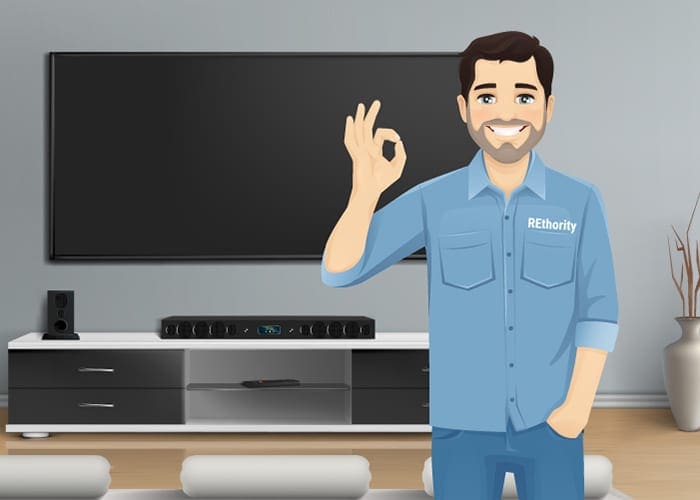 An extremely handsome guy in a Rethority shirt giving the OK sign with his hands because he helped you pick the best TV mount for your home