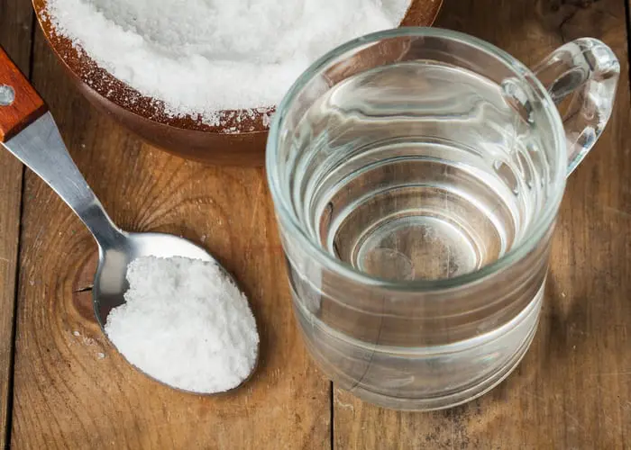 To make a natural weed killer, a spoon of salt, sugar, soda with glass of water