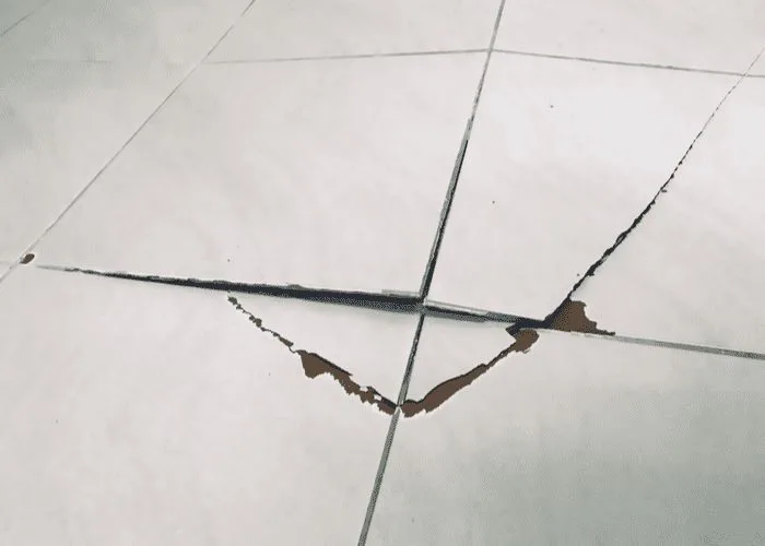 To help answer can you tile over tile, a few pieces of tile cracked and bowing