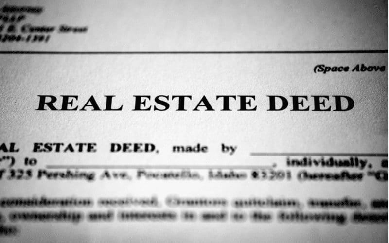Real estate deed zoomed in on in black and white