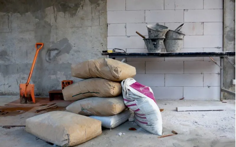 Cement bags stacked in a house for a piece on how much cement do I need