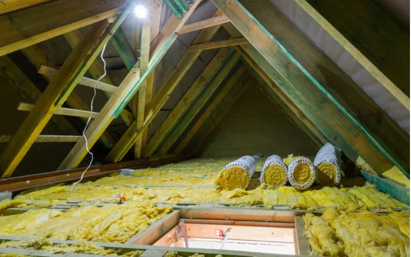 To illustrate the difference between faced and unfaced insulation, an attic that has a few rolls of unfaced insulation and lots of exposed studs