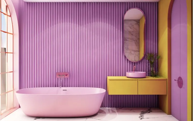 Bright and colorful bathroom inspiration example of a purple vertical striped wallpaper with marble tile next to a giant front window
