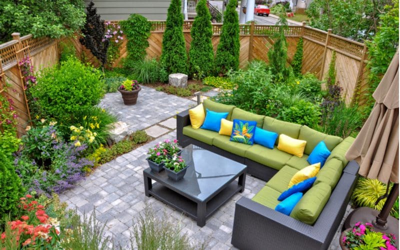 Idea for a paver patio divided up with grass and cinderblocks