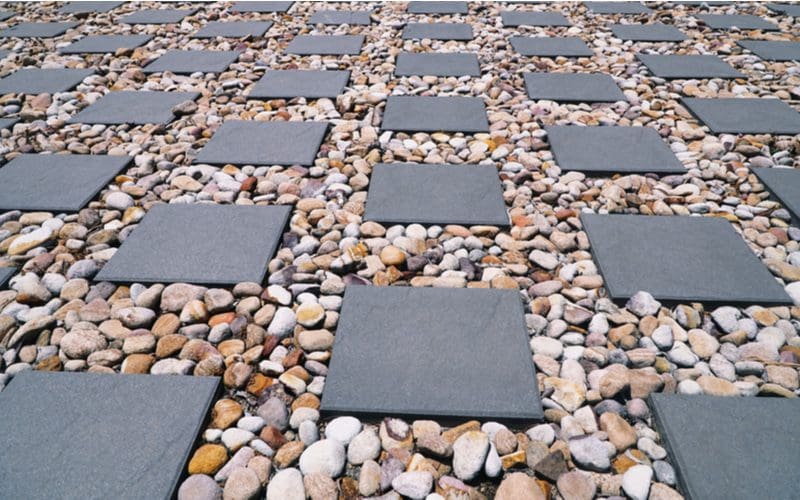 Paver patio made up of rock and pavers in a long flat surface