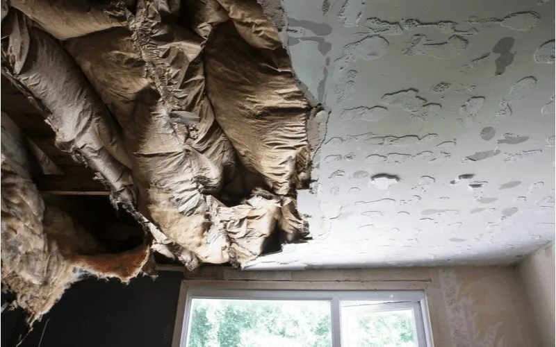 To help illustrate mistakes you can make insulating your garage ceiling, a water-damaged ceiling insulation bunch