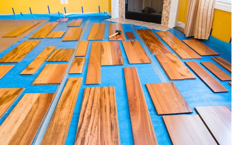 Step 3 in installing laminate flooring involves laying out the planks