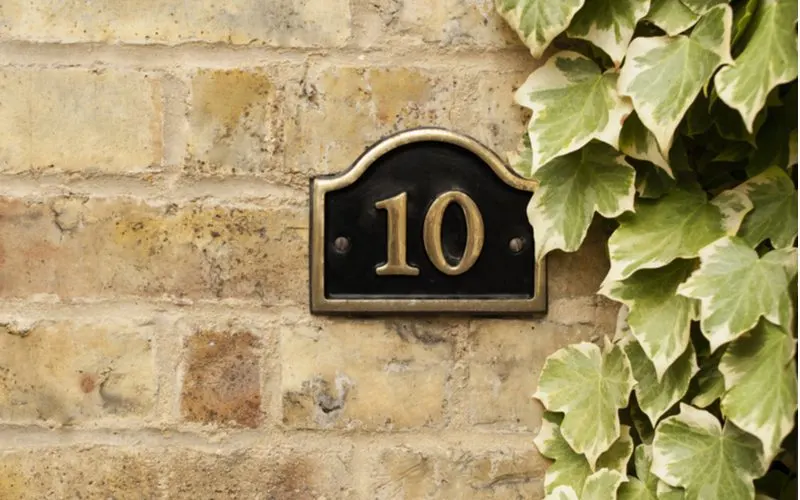 As an image for a piece on easy curb appeal ideas, a number 10 on a metal plate on brick wall