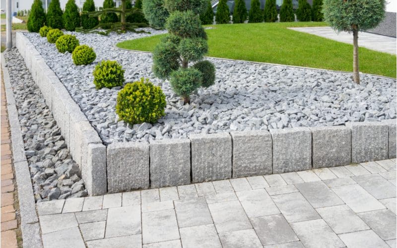 Modern Japanese garden with boxwoods and rock for a piece on landscaping ideas