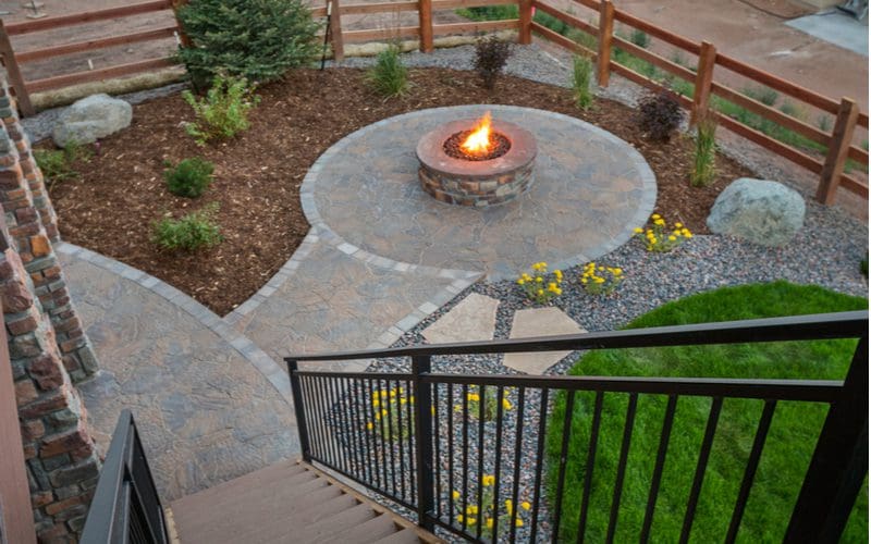 Paver patio idea with lots of flagstone pavers making up a walkway, patio and firepit