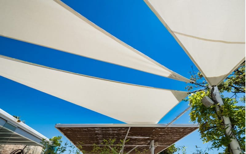 Sun shades above a big Spanish beach for a piece on patio shade ideas