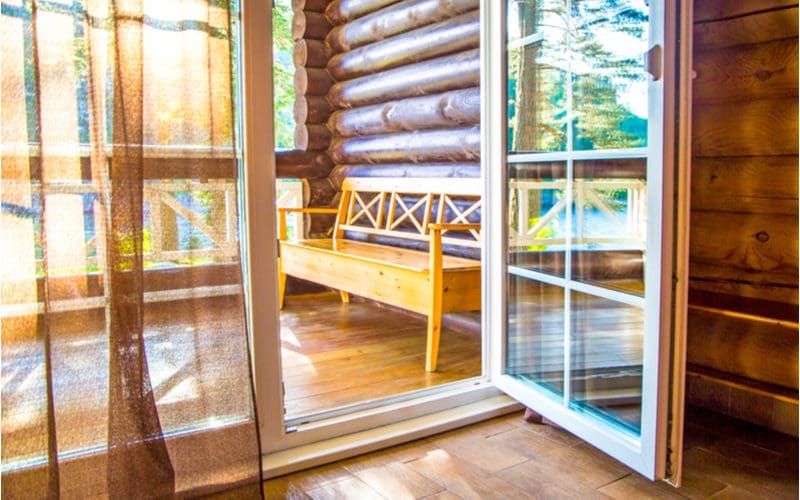 For a piece on French door sizes, such a door opens inward into a modern log cabin