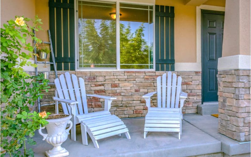 Wooden white adirondack chairs as inspiration for front porch furniture ideas