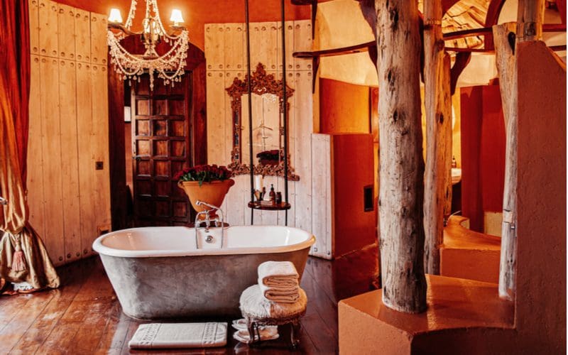 Tribal-style bathroom with a tree on the inside in what would be considered to be an African-inspired bathroom design idea