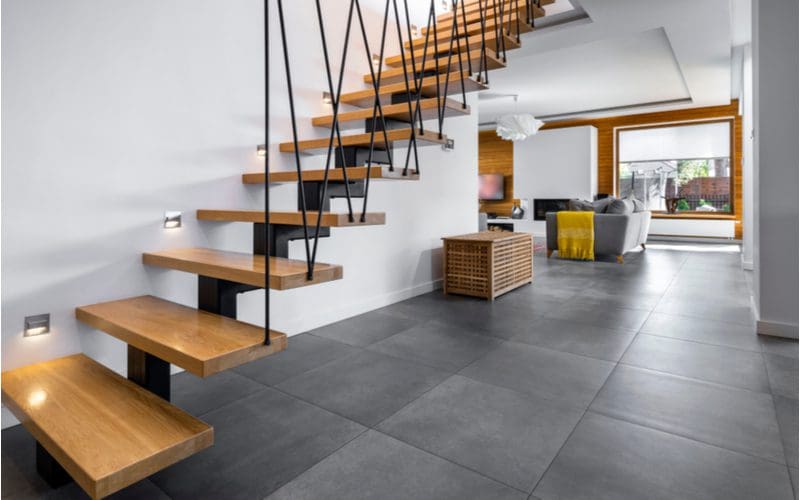 Stair trim ideas showing a floating staircase suspended by cables
