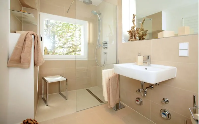 Ada-compliant shower with a bench on the inside for a piece on standard shower dimensions
