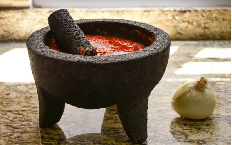 No mexican kitchen would be complete without a stone mortar and pestle, as displayed in this up-close image