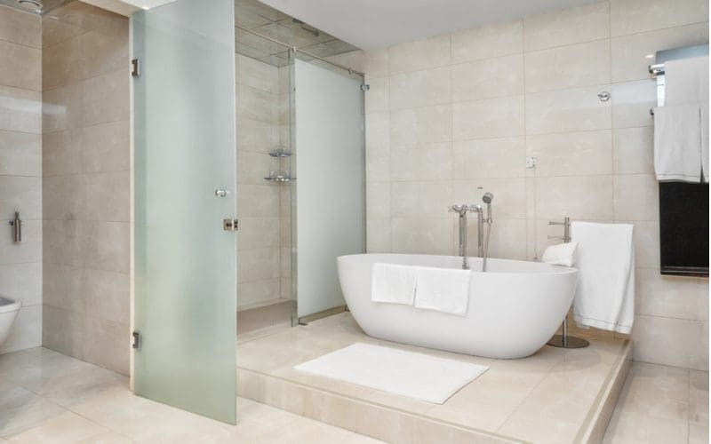 Image of a grey tile bathroom idea with lots of grey tile on every wall and floor