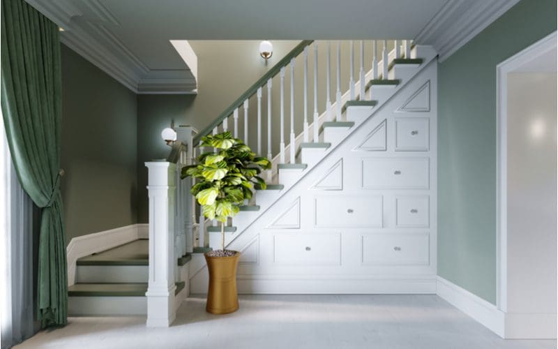As an example for a piece on wainscoting ideas, a wardrobe under the staircase in a nice and open home